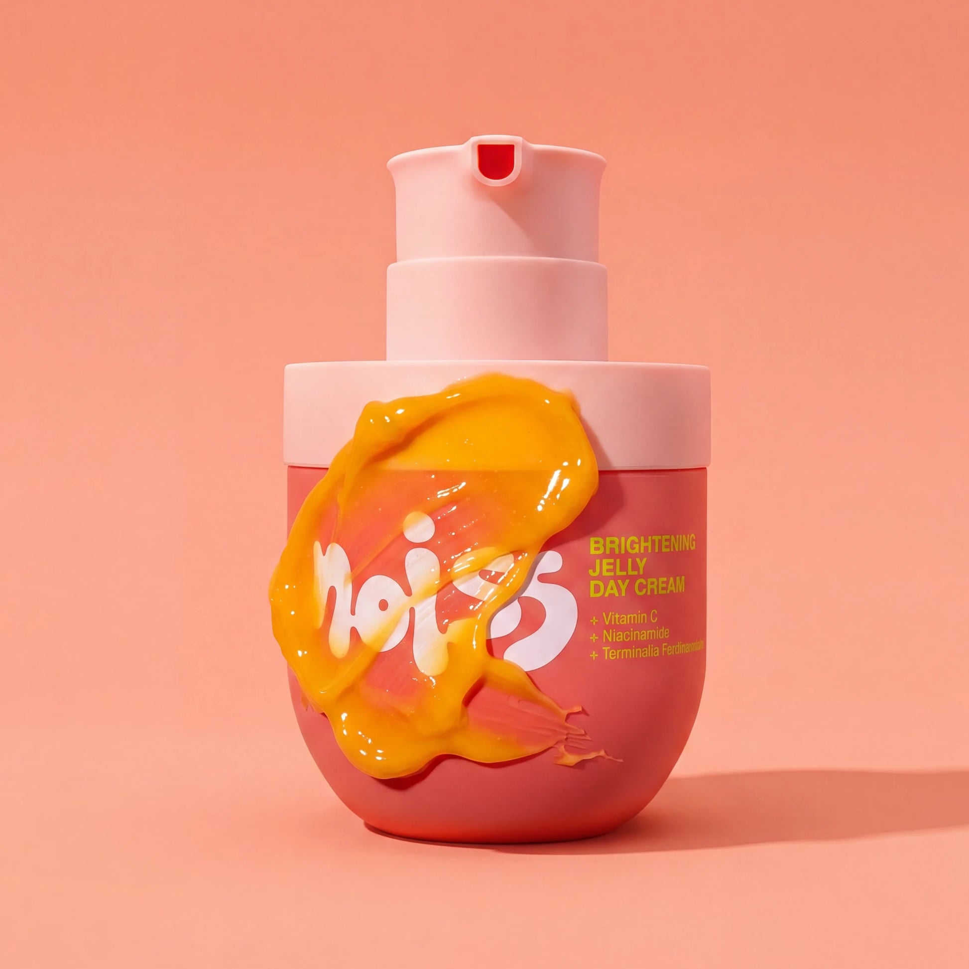NOISS Brightening Jelly Day Cream pump bottle with golden jelly texture smeared on front