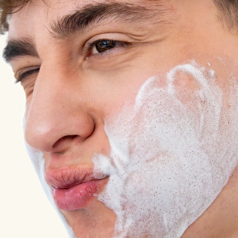 Man applying NOISS Purifying Oxygen Foam Cleanser to face