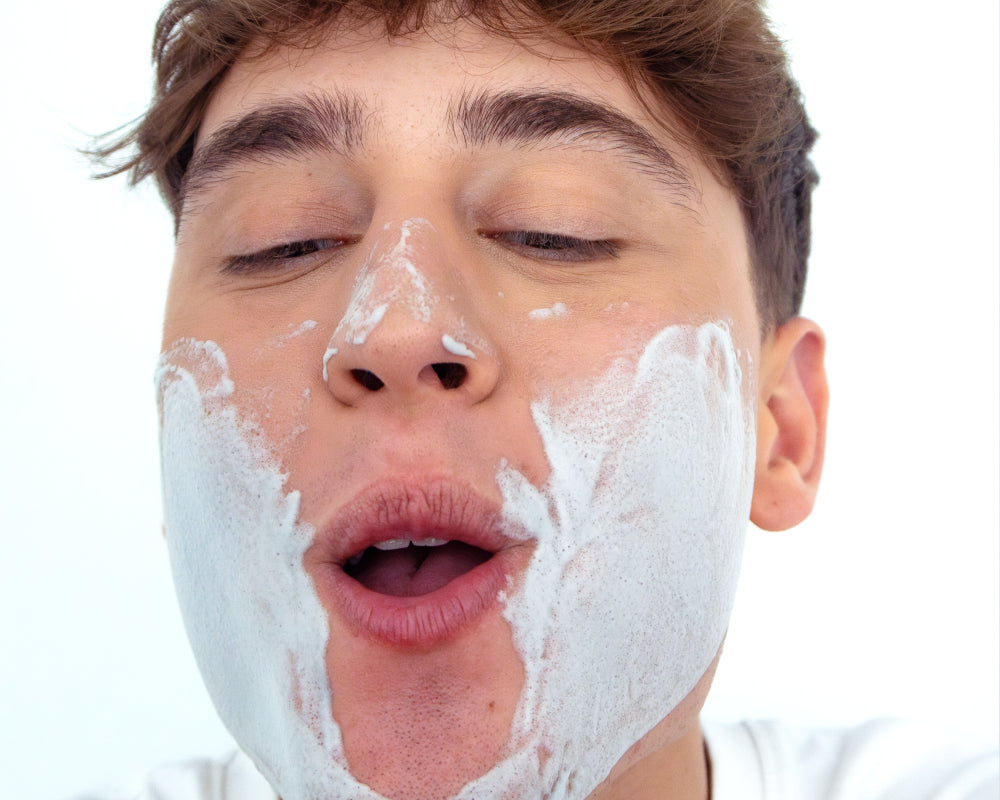 Creator holding NOISS Purifying Oxygen Foam Cleanser